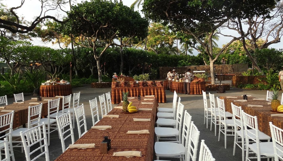 luau tables and chairs set up for dinner