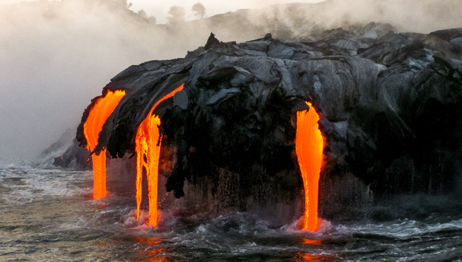 Lava Flowing into the ocean on a lava boat tour