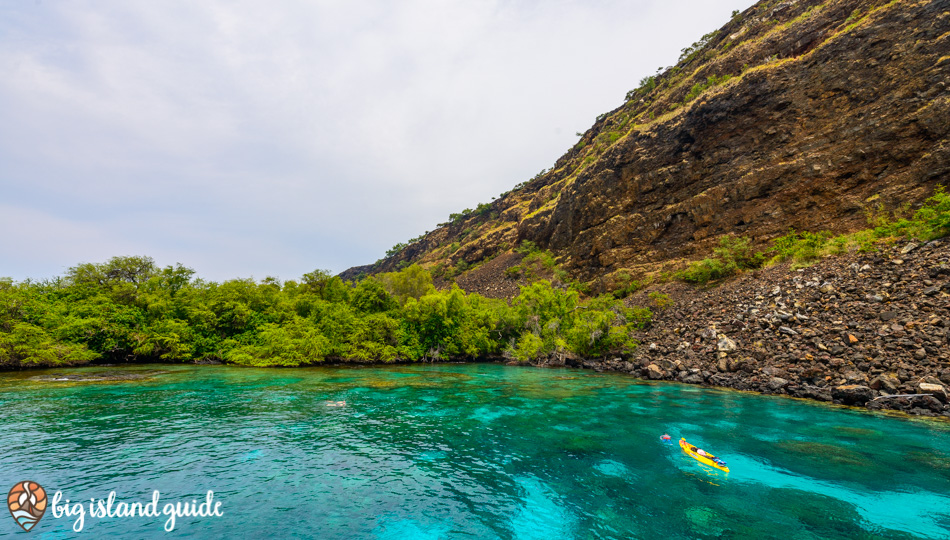 teal water and a kayak at Kealakekua Bay