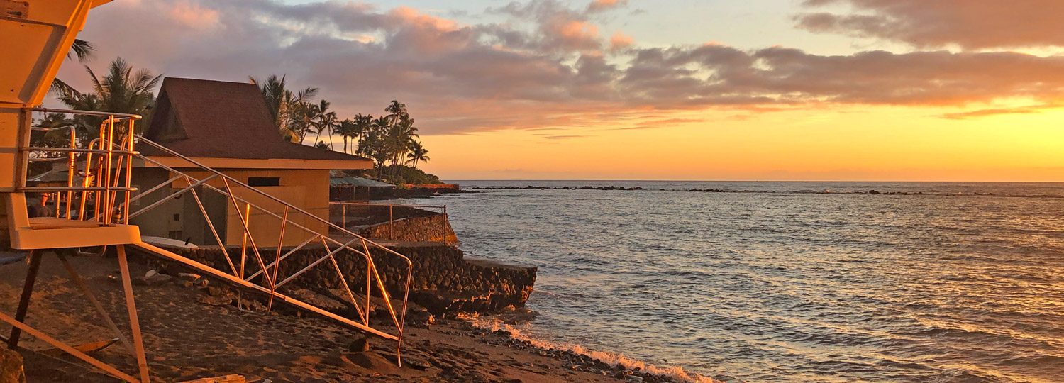 Kahaluu beach park lifeguard stand at sunset